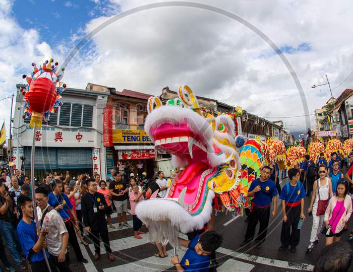 200M Dragon Dance Perform With Pearl At Street In Bright Sunny Day