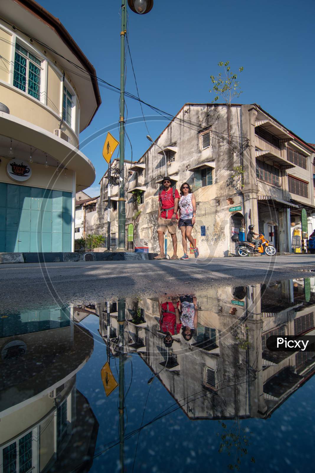 Reflection Tourist Walk At Street In Penang
