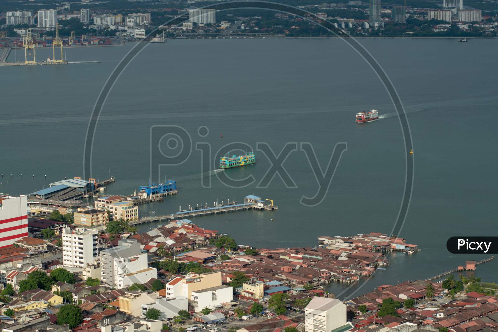 Aerial Red, Green, Blue Ferry Move At Penang Port