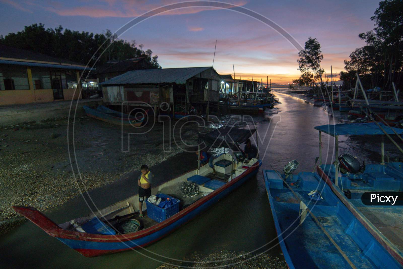 A Local Fisherman Back From Sea During Dusk Hour