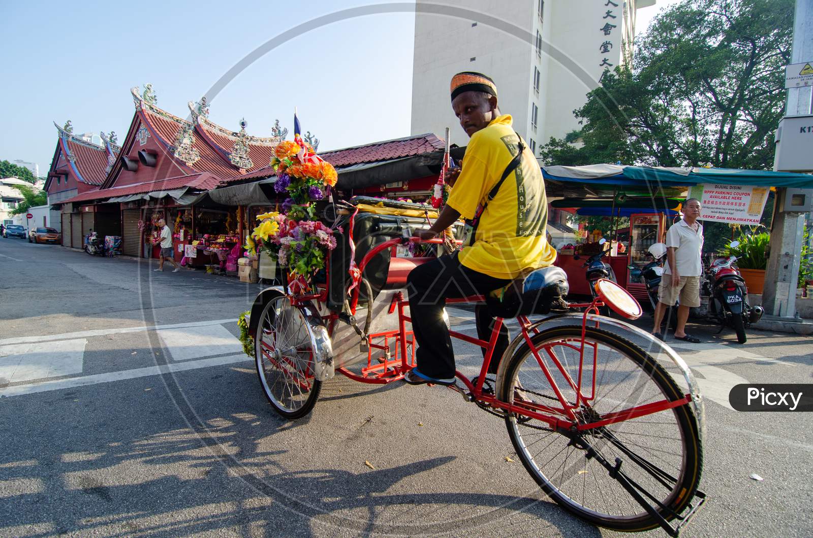 Rickshaw Driver At The Street Near The Goddess Of Mercy Temple