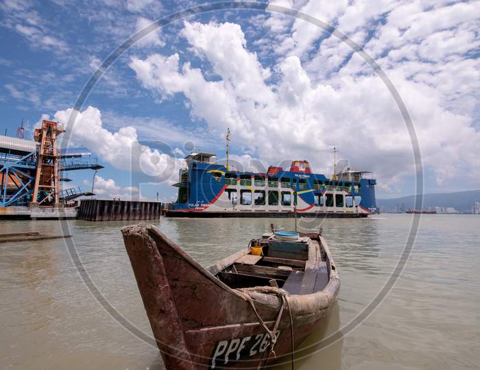 Traditional Fishing Boat And Ferry In Hot Sunny Day