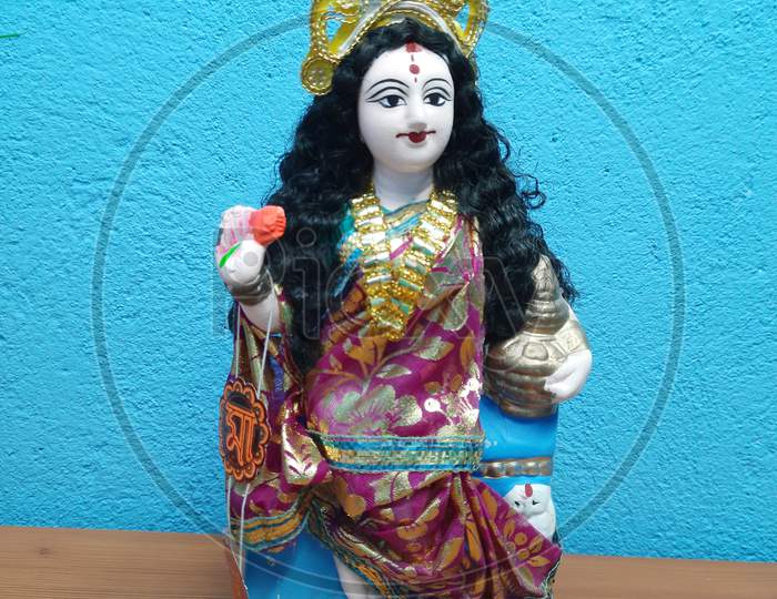 Picture of Laxmi maa idol image in blue Background, Background Blur, nice idol, idolimage,