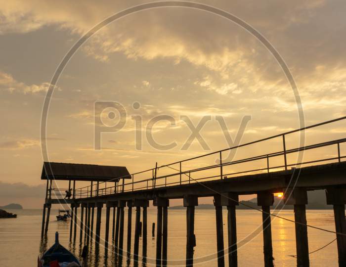 Fisherman Boat Park Beside Jetty During Sunset