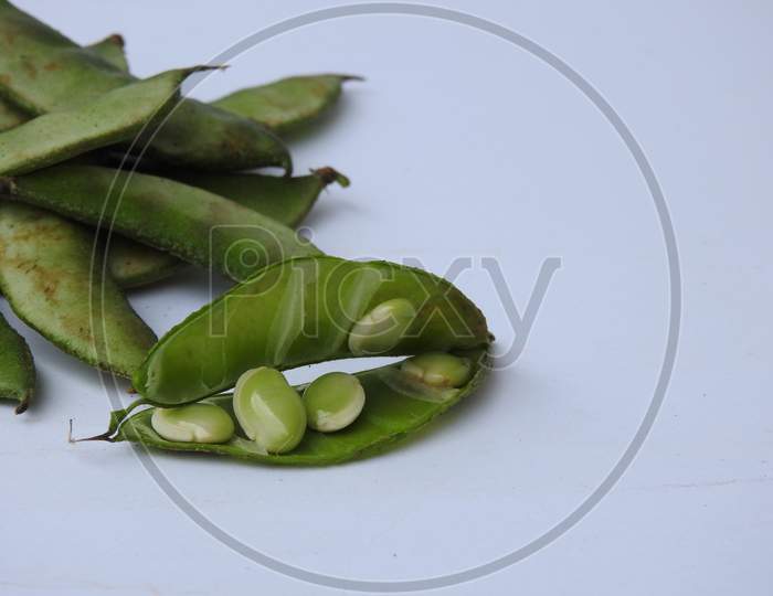 Indian Hyacinth Beans or Avarekai with and without peeled seeds isolated on white background