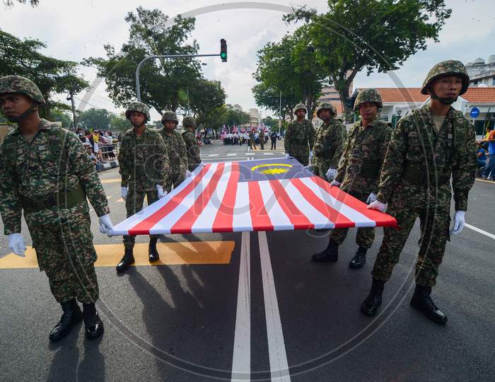 Soldier Carry Malaysia Flag During National Day Parade