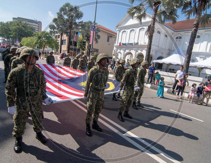 Malaysia Soldier Marching With Malaysia Flag