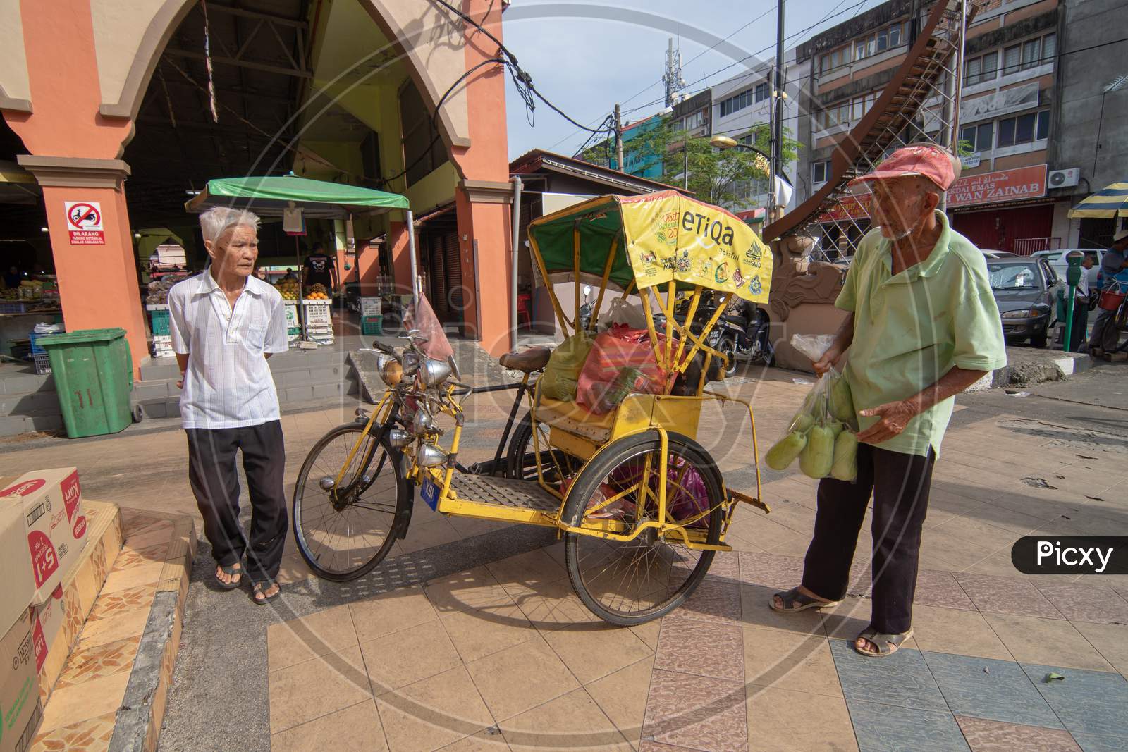 A Man Use Rickshaw To Carry Goods