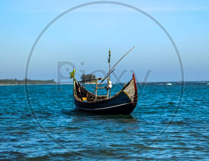 Floating Boat In Blue Sea