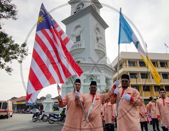 Malays Attend The Independence Parade In Front Of Clock Tower