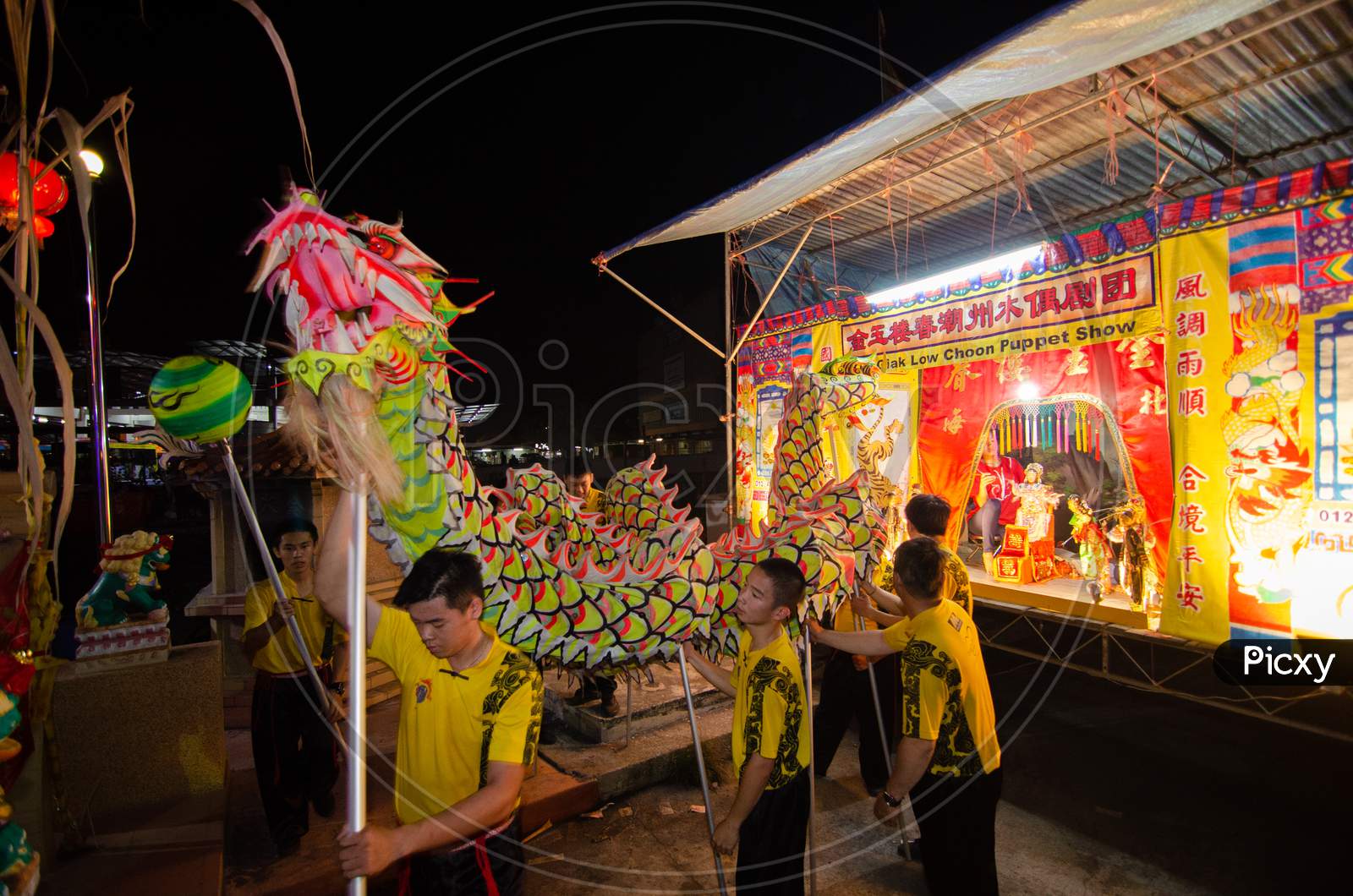 Traditional Dragon Dance And Puppet Show During Festival