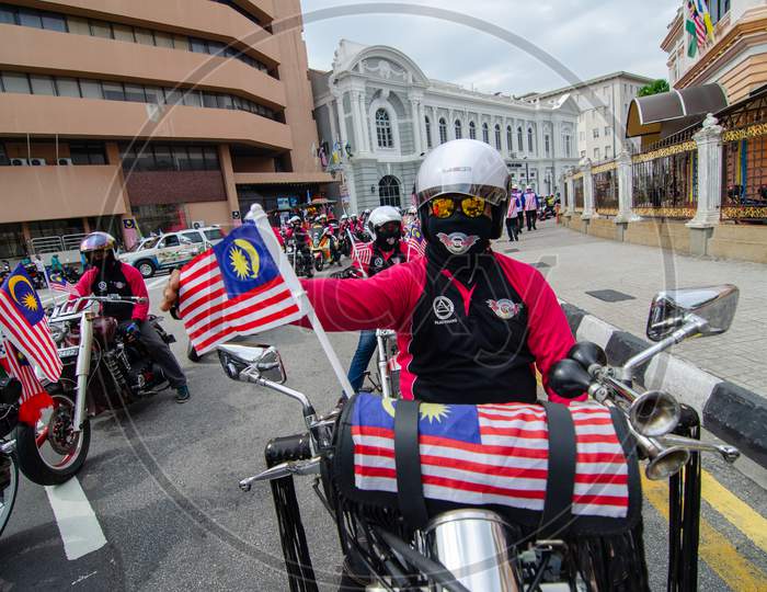 Motorcyclist Hang The Malaysia Flag