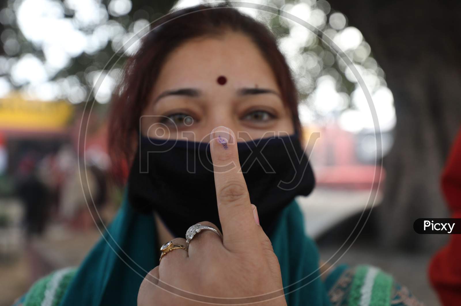 Villager woman show their fingers marked with indelible ink after casting their votes during the second phase of the District Development Council (DDC) election at Meen Sarkar Sambha in Jammu, Tuesday, Dec. 1, 2020.