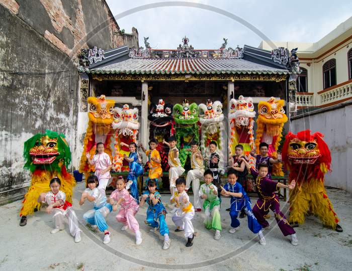 Chinese Kungfu Teenagers And Lion Dance Perform In Front Of Temple Penang Loo Pun Hong