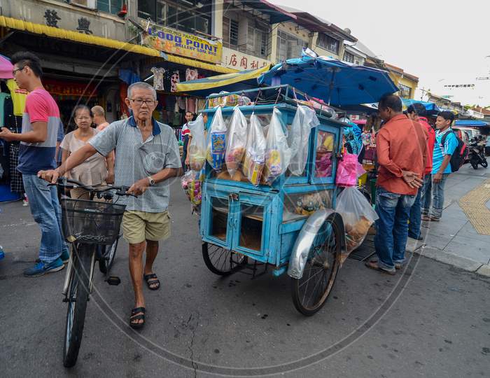 Bread Seller With Rickshaw At Street