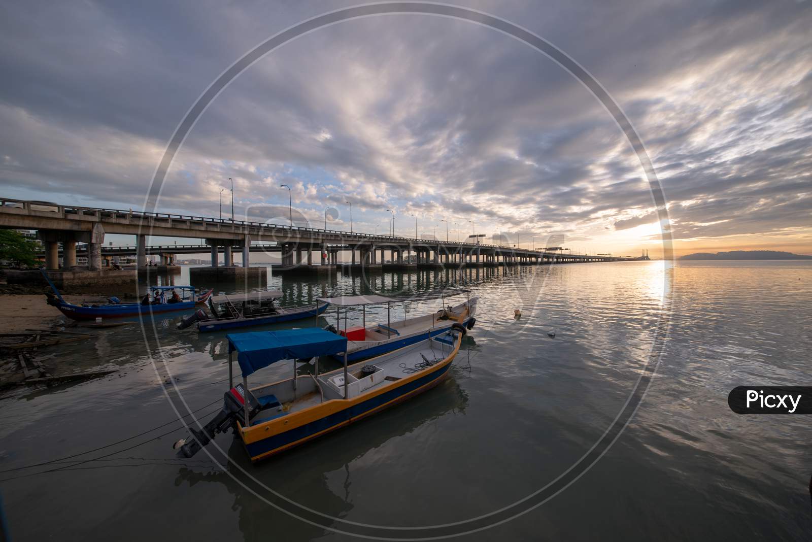 Fishing Boat Park Beside Penang Bridge In Morning Sun Rise