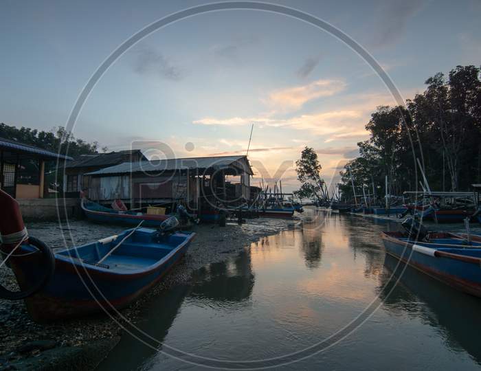 Traditional Malays Fishing Village In Sunset