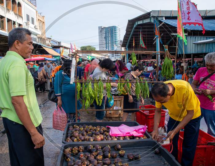 Hawker Sell Petai And Mangosteen At Morning Market