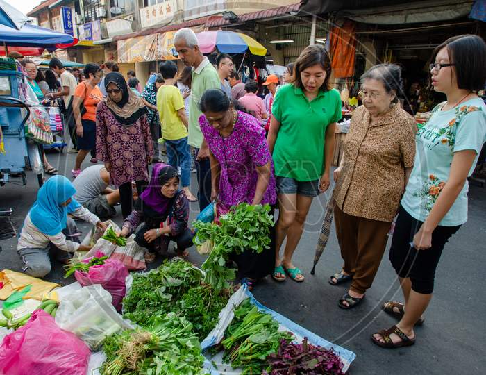 People Buy Vegetables At The Wet Market At Penang Street.