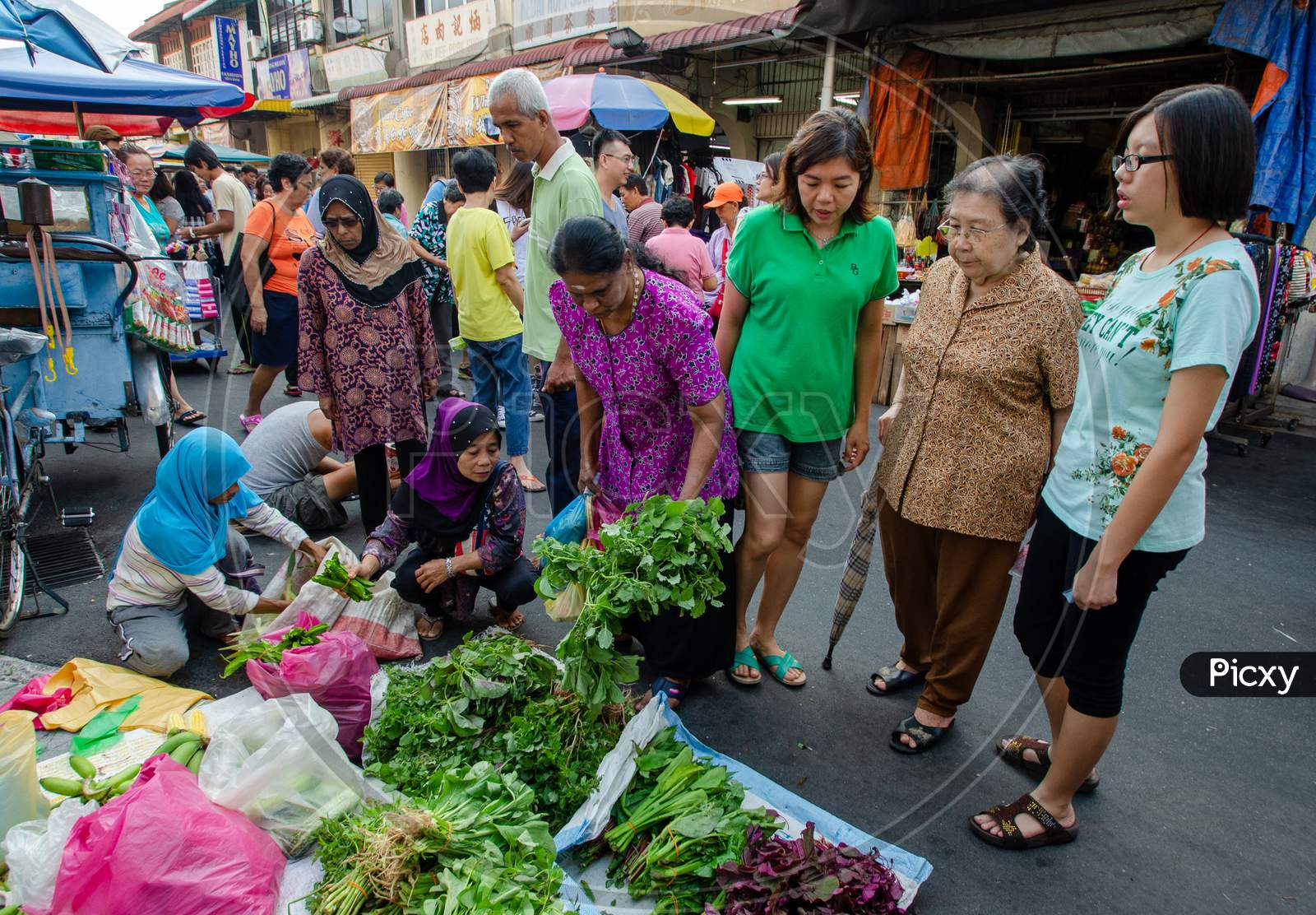 People Buy Vegetables At The Wet Market At Penang Street.