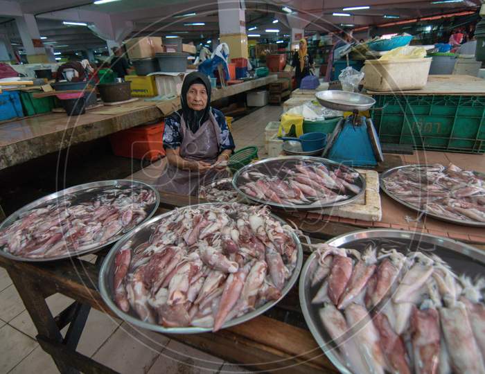 A Woman Sell Squid At Pasar Siti Khadijah