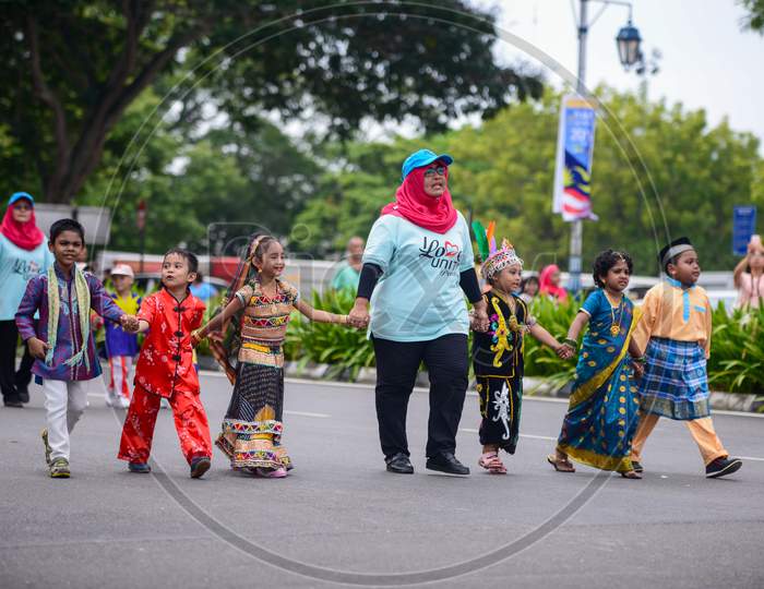 Children From Different Races Walk To Together During Independence Parade