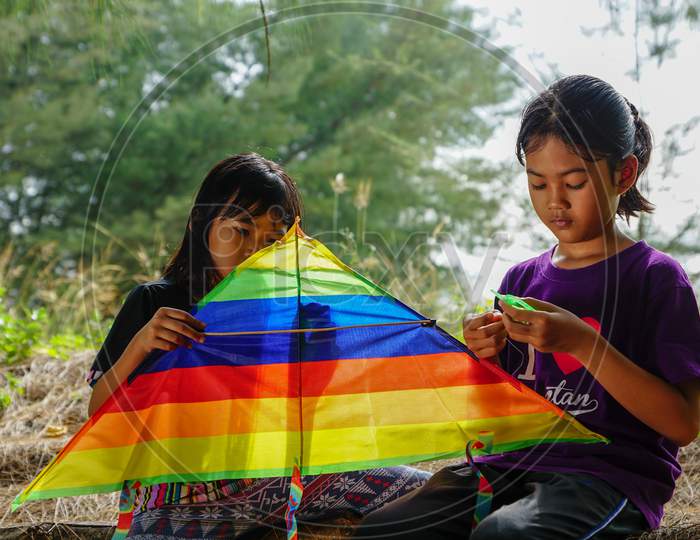 Two Malay Kids Play Kite