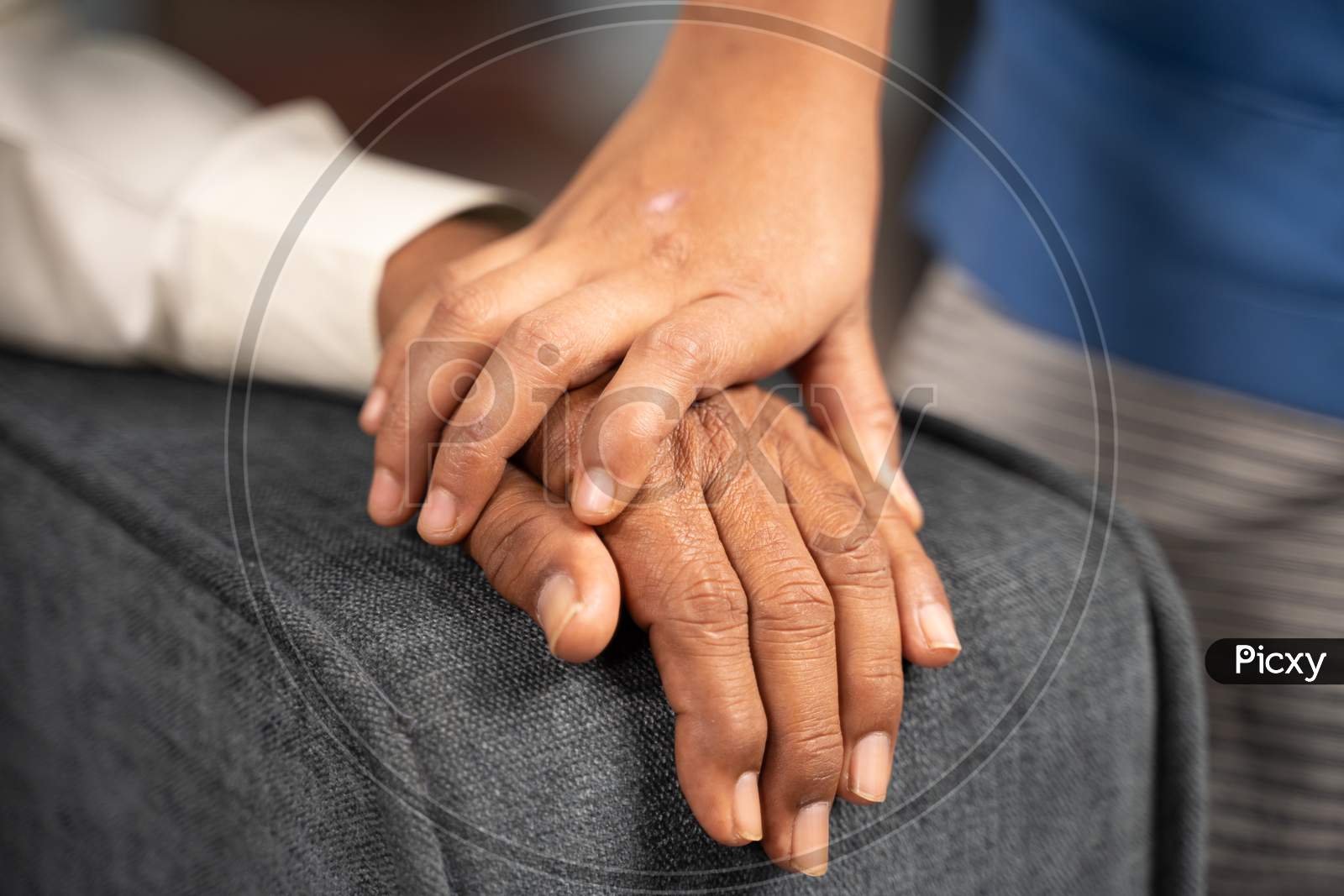 Close Up Of Doctor Hands Holding Hand Of A Senior Citizen With Condolence - Concept Of Philanthropy, Caregiver And Kindness To Elderly.
