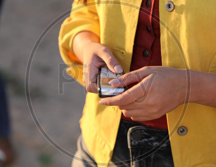 Female hands with cell phone