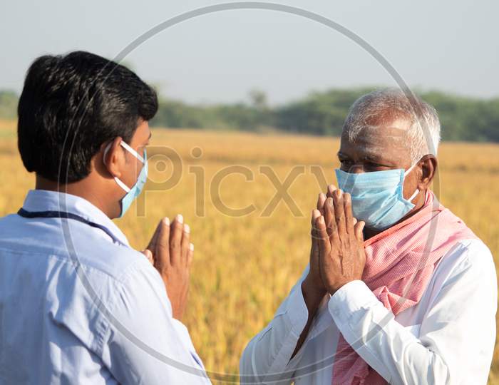 Farmer greeting to banker or corporate government...