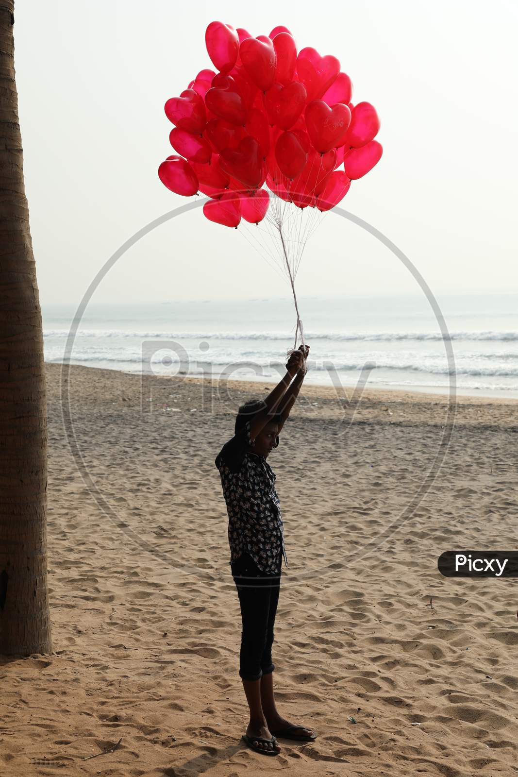 Air Balloon Seller in a Beach