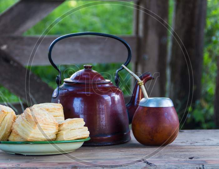 Kettle And Yerba Mate To Drink The Traditional Infusion Of Argentina With Salty Fat Biscuits