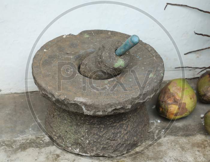 Vintage Stone Grinder at rural home