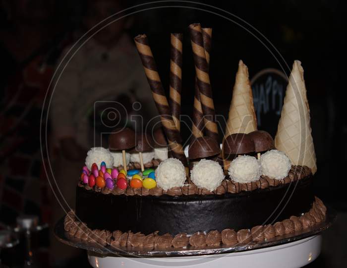A Beautiful Birthday Cake Made By Chocolate Garnish With Chocolate