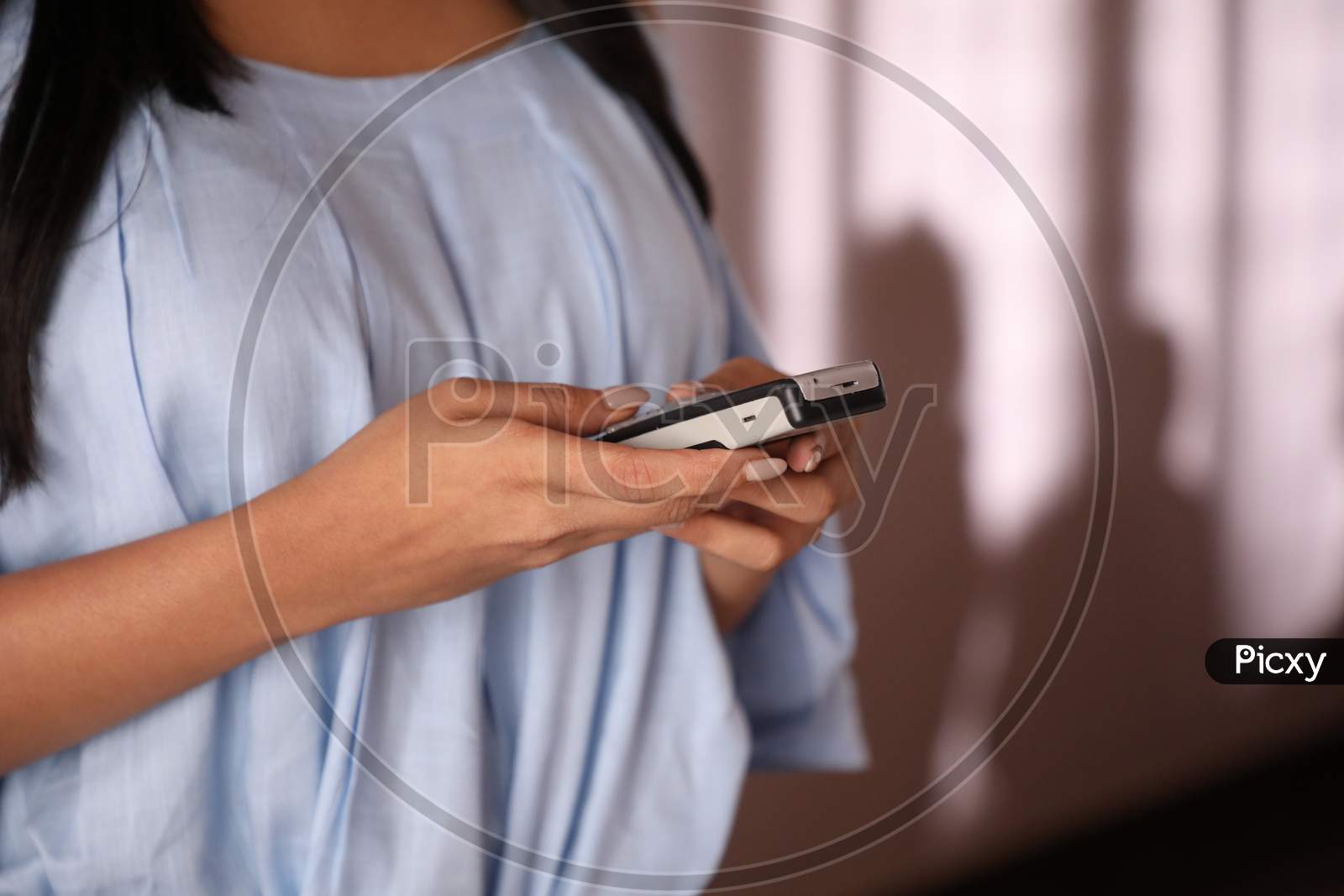 Woman using smart phone hands only