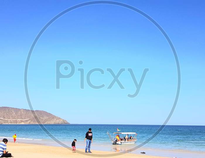 Beach.dubai Island. Public beach. Water. Blue sky. Public or man enjoy on the beach