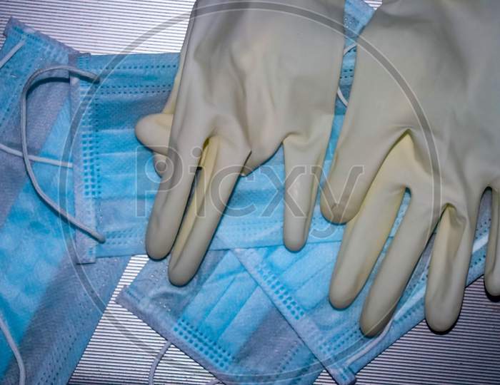 Close up of Surgery hand gloves and face protection mask used to protect from coronavirus covid-19 pandemic