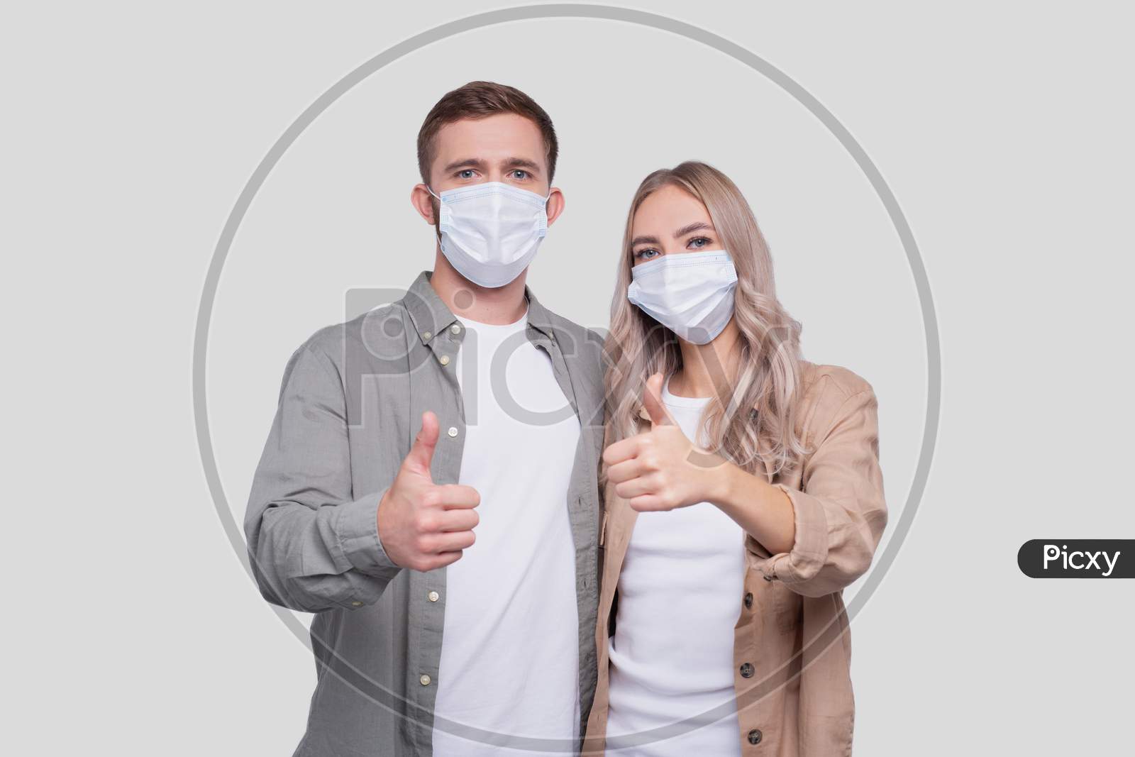 Couple Wearing Medical Mask Showing Thumb Up Isolated. Man And Woman Hugging, Lovers, Friends, Couple, Virus Concept