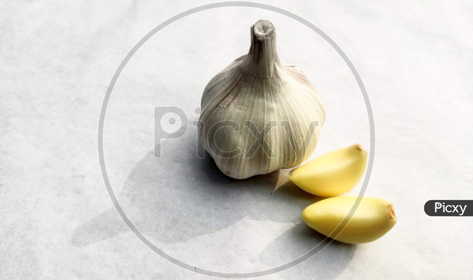 Close-Up Dried Garlic And Garlic Bulb On A White Background.Copy Space For Text.