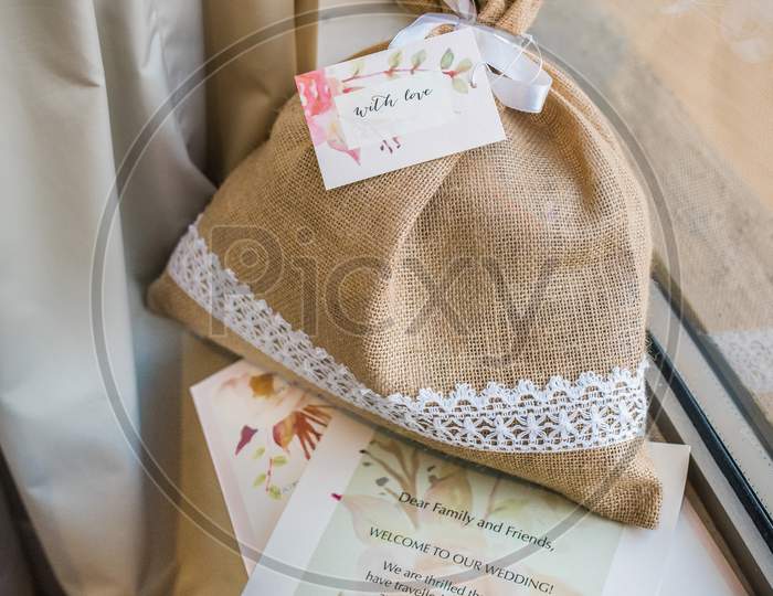 Marriage Invitation Card With Beautiful Jute Bag And Flowers