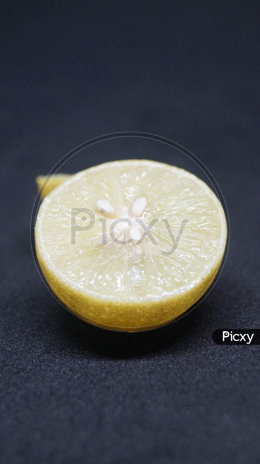 Slice of lemon with black background