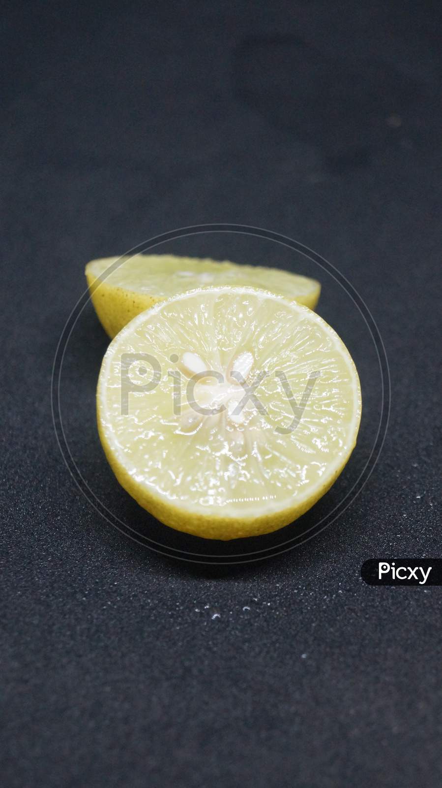 Slice of lemon with black background