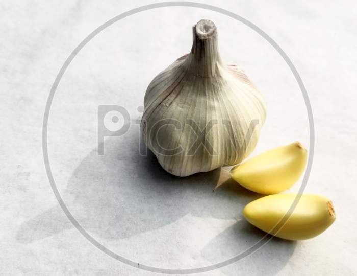 Close-Up Dried Garlic And Garlic Bulb On A White Background.Copy Space For Text.
