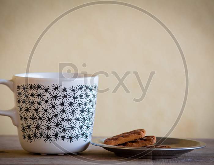 Mug With Coffee Or Tea Along With Biscuits. Refreshment During The Break From Work. Tea Break From Work