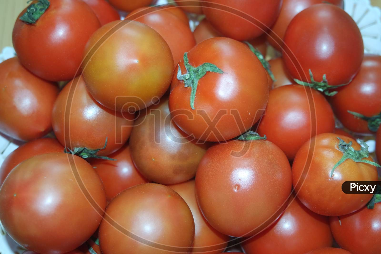 Close-Up View Of Red Tomatoes In Market For Sale