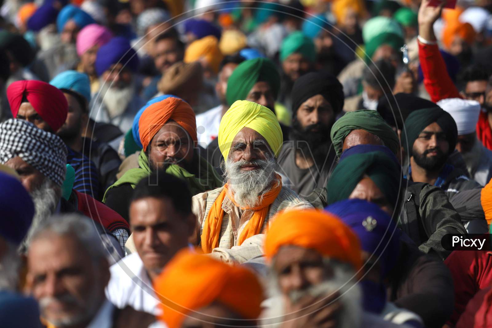 Farmers Listens To A Speaker Along A Blocked Highway During The Ongoing Sit-In Protest At Singhu Border Against New Farm Laws On December 13, 2020 Near New Delhi, India. Thousands Of Farmers Are Protesting On Various Borders Of The National Capital Since November 26.