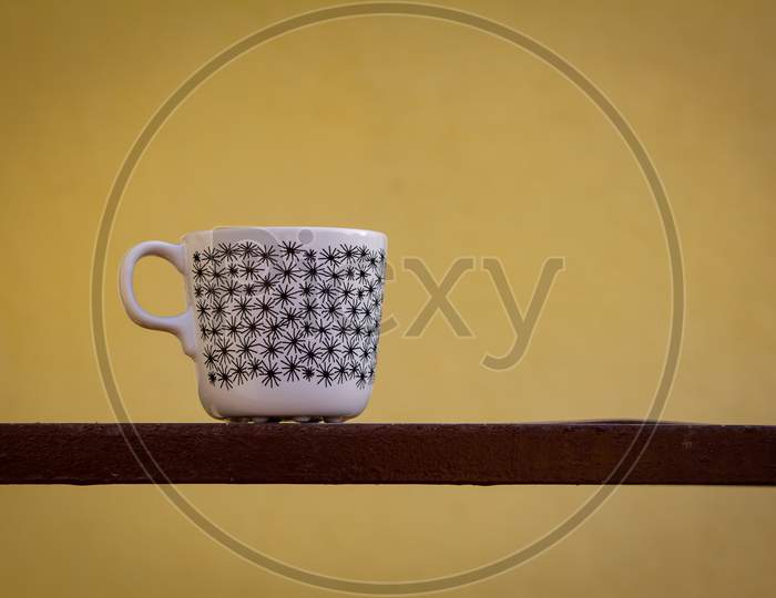 View Of Ceramic Mug Isolated Against Simple Background. Coffee Mug Isolated With Minimalist Design