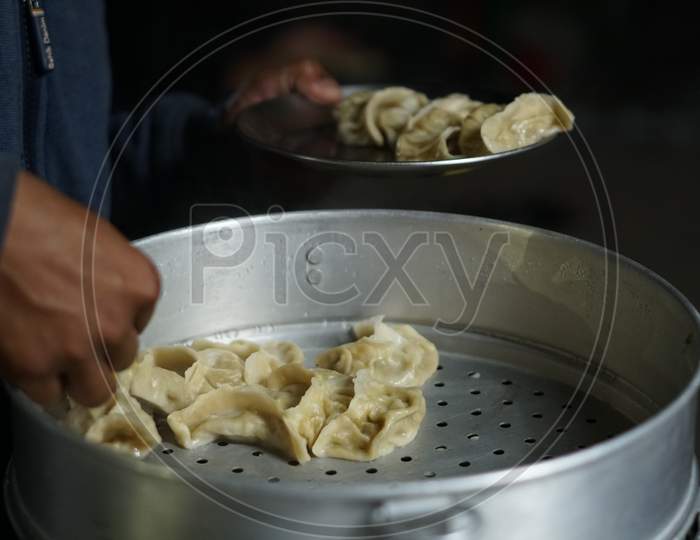 Streetfood stall selling hot steamed momos.