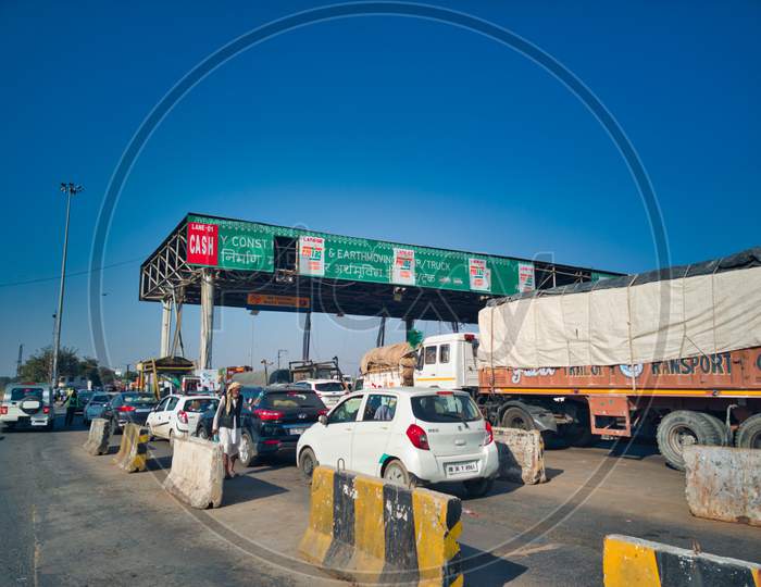 Fastag Enabled Toll Booth Plaza And Toll Gates With Traffic Lined Up In Each Gate