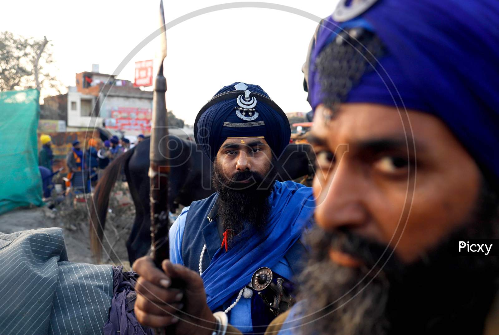 Nihang (Sikh Warrior) Poses For A Photograph Near The Road Blockade Against The Newly Passed Farm Bills At Singhu Border Near Delhi, India On December 13, 2020. Thousands Of Farmers Are Protesting On Various Borders Of The National Capital Since November 26.